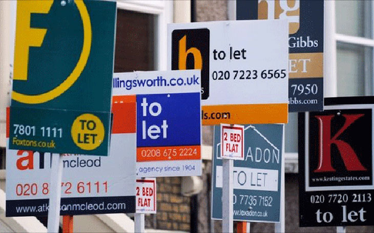 Cluttered To Let estate agent boards
